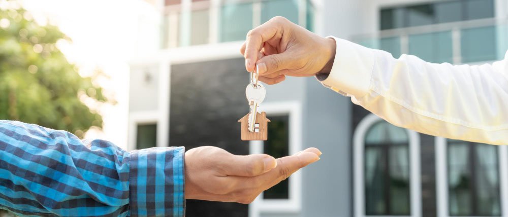 Tenant holding keys outside a Clark County apartment — Fair Housing Act discrimination lawyer serving Las Vegas